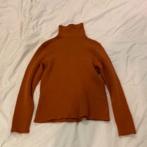 Warm orange turtleneck sweater